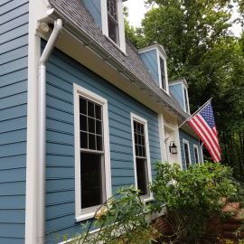 <p>Raleigh James hardie siding with Vytex Windows and Barrel gutters anodized.</p>
